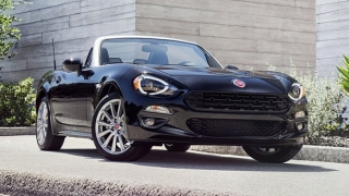 Fiat 124 spider black press photo